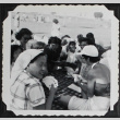 Card games at a picnic (ddr-densho-300-538)