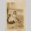 Woman sitting on ground (ddr-densho-523-20)