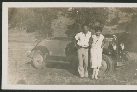 couple in front of car (ddr-densho-378-891)