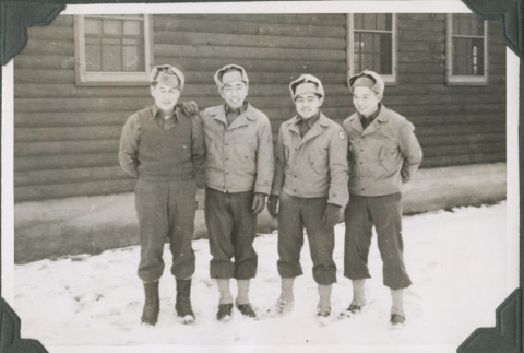 Four man standing outside camp building in snow.  Joe Iwataki second from left (ddr-ajah-2-458)