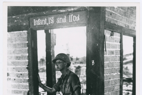 Serviceperson looking for cover in Burma (ddr-densho-1007-20)