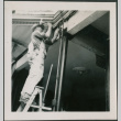 Man hammering bolt into beam (ddr-densho-426-2257)
