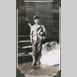 Man in uniform outside barracks (ddr-ajah-2-82)