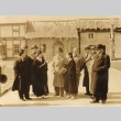 Group of men in Western clothing and two women in kimono (ddr-njpa-4-28)