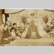 Men, women, and children at a Buddhist [?] ceremony (ddr-njpa-6-41)