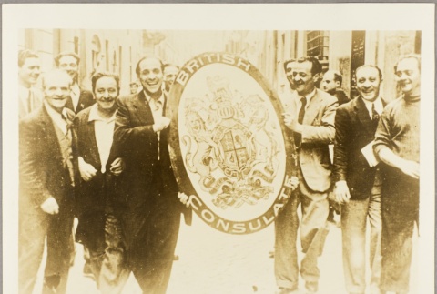 Men carrying a coat of arms shield from the British consulate in Rome (ddr-njpa-13-712)
