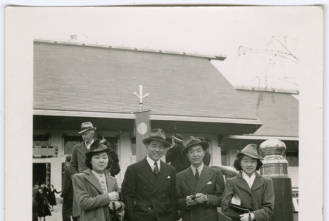 Four people exiting event (ddr-densho-329-803)