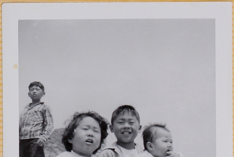 Three children on beach (ddr-densho-522-359)