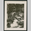 woman lounging in forest (ddr-densho-378-851)
