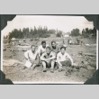 Five men sitting in field with camp gear.  Joe Iwataki in back on right. (ddr-ajah-2-242)