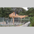 Carpenter Dave Schmidt dressing beams on overlook structure (ddr-densho-354-2287)