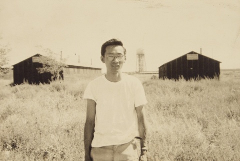 Japanese American man outside barracks (ddr-densho-72-24)