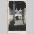 Three men and woman on a porch (ddr-manz-10-98)