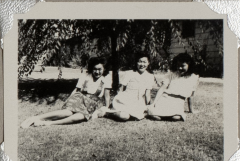 Three women sitting on lawn (ddr-densho-587-44)