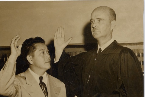 Chuck Mau taking an oath from a judge (ddr-njpa-2-684)