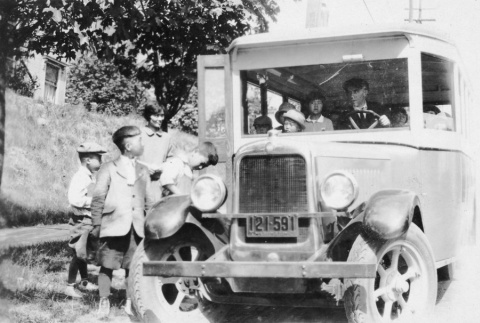 (Photograph) - Image of boys getting on bus (ddr-densho-330-255-master-49e872a500)