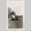 Woman sitting on a lawn (ddr-manz-10-95)