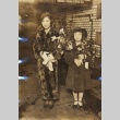 Woman and a girl posing holding flowers (ddr-njpa-4-20)