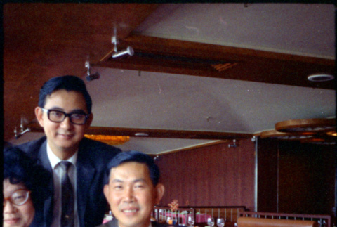 Martha (Nozawa) Tsuchida and two men in restaurant (ddr-densho-426-764)