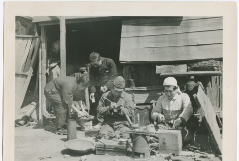 Japanese men and women working in front of a shack (ddr-densho-299-50)