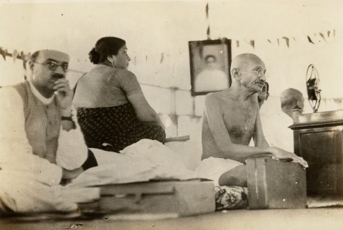 Gandhi seated, holding a suitcase (ddr-njpa-1-453)