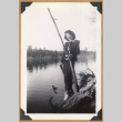 Woman poses on a fallen tree (ddr-densho-542-325)