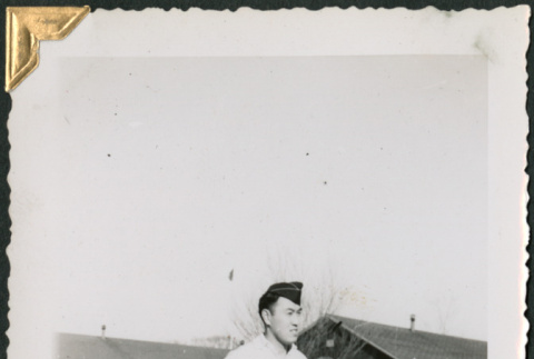 Man standing outside buildings (ddr-densho-434-316)