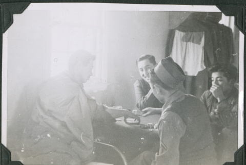 Four men playing cards (ddr-ajah-2-536)