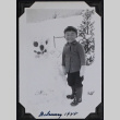 Boy poses with snowman (ddr-densho-359-1551)