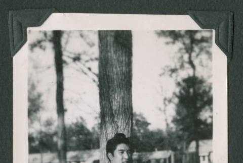 Man leaning against a tree (ddr-densho-471-72)