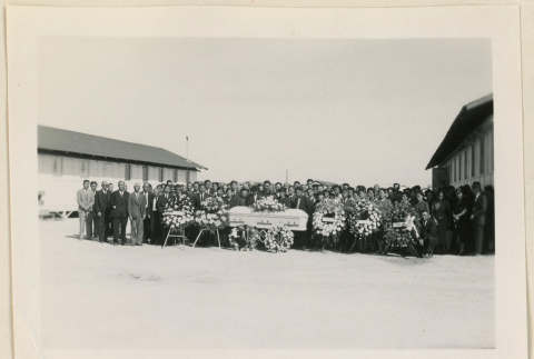 Funeral attendees around Mr. Yamamoto's casket (ddr-densho-37-928)