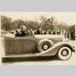 Franklin D. Roosevelt waving from a car (ddr-njpa-1-1527)