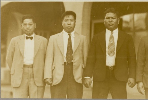 Group of four men including sumo wrestler Isamu Date (ddr-njpa-5-437)