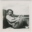Guyo Tajiri sitting on a dock (ddr-densho-338-281)