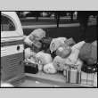 Baggage of Japanese Americans next to bus (ddr-densho-151-165)