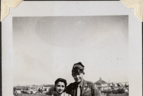 Man and woman standing on rooftop (ddr-densho-466-829)