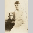 A man posing with a portrait (ddr-njpa-1-829)