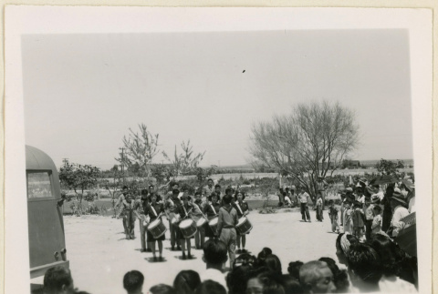 Drum and bugle corps perform for a crowd (ddr-densho-37-1432)