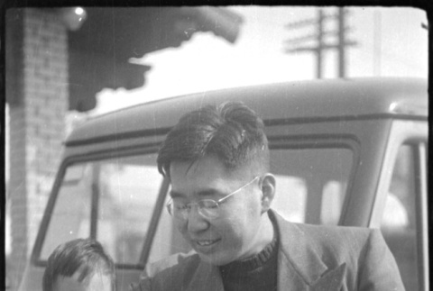 Henri and Norman Takahashi by car (ddr-densho-426-785)