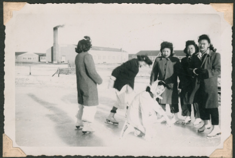 Ice skaters wait for a friend (ddr-densho-463-110)