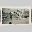 Group cooking on the beach (ddr-densho-321-169)