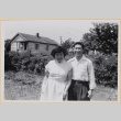 Couple in yard with house in background (ddr-densho-522-49)
