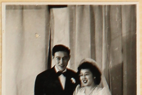 Bride and groom cutting cake (ddr-densho-522-44)
