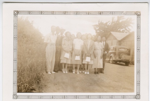 Co-ed group in front of a car (ddr-densho-313-31)