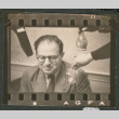 Man surrounded by various objects (ddr-densho-433-779)