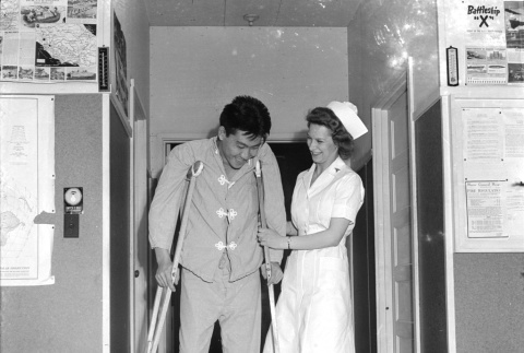 Nurse and patient on crutches (ddr-densho-1007-463)