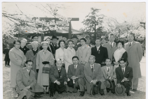 Mitsuye Yabe and Tour Group Pose in Front of Trees (ddr-ohs-1-122)