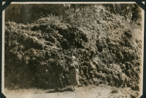 Woman poses in front of cliff (ddr-densho-359-530)