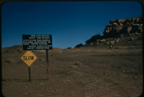 Traffic sign next to rock formations (ddr-densho-338-499)