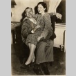A woman sitting on a Jack Sharkey's lap (ddr-njpa-1-1921)